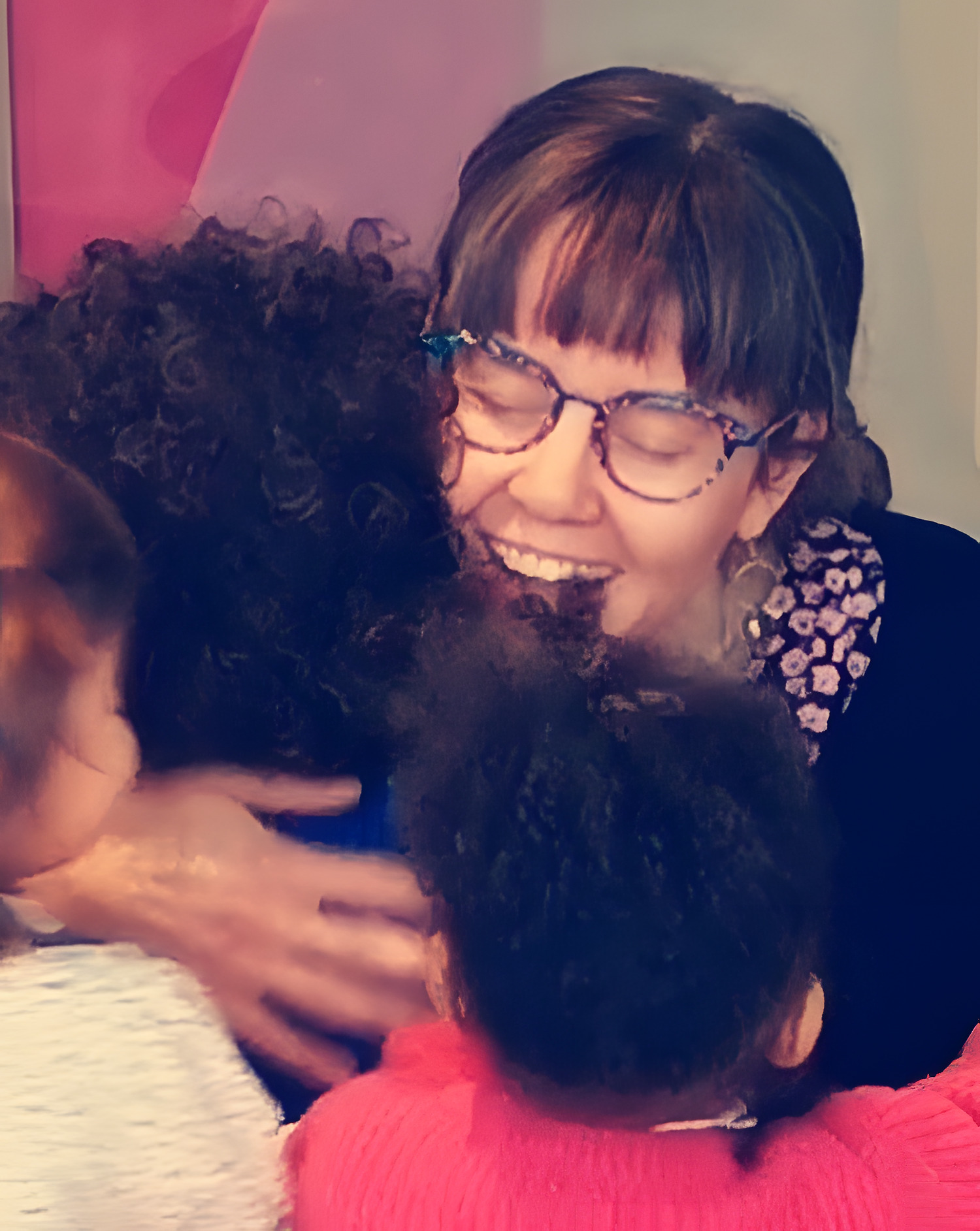 Aga hugging two children